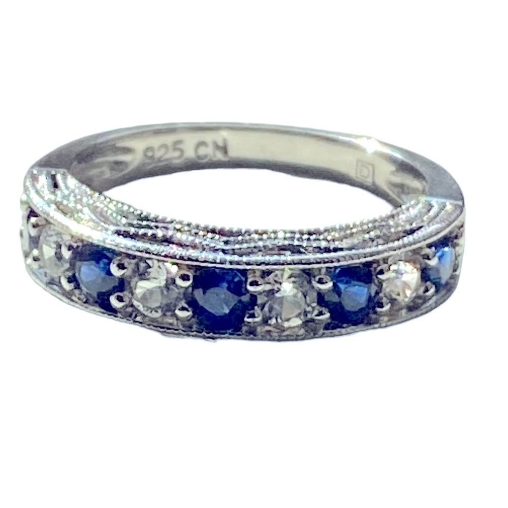 Sterling silver band with blue and white sapphire stones.